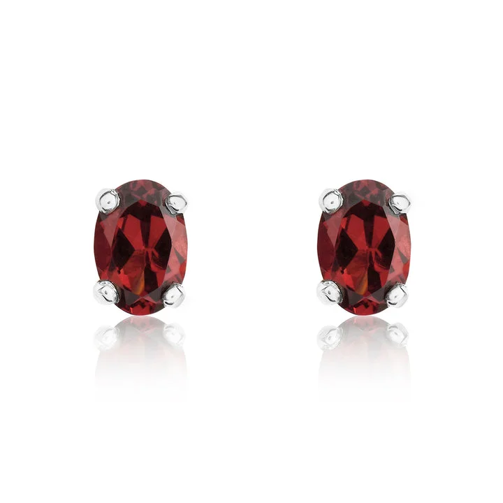 Crystal Earrings for Weddings-9ct white gold 6x4mm oval garnet claw set stud earrings